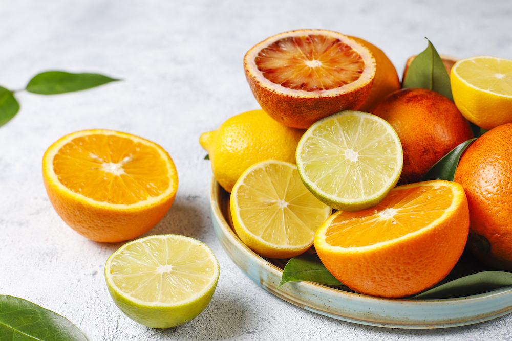 Citrus background with assorted fresh-citrus fruits,lemon,orange,lime,blood orange,fresh and colorful,top view